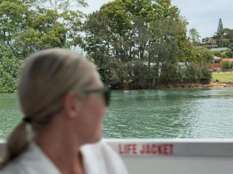 Guest looking over scenic river.