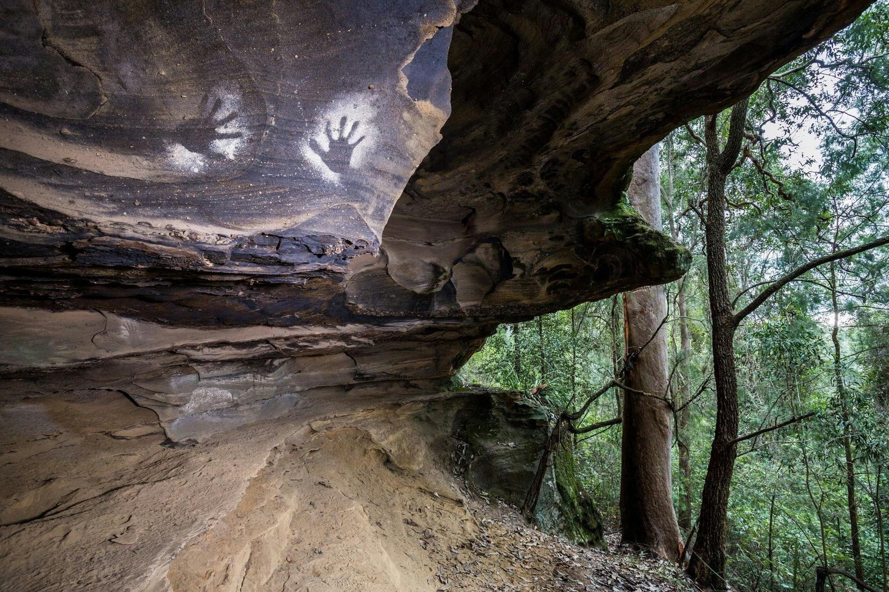 CAVE WITH HAND STENCILS, BROKENBACK RANGE