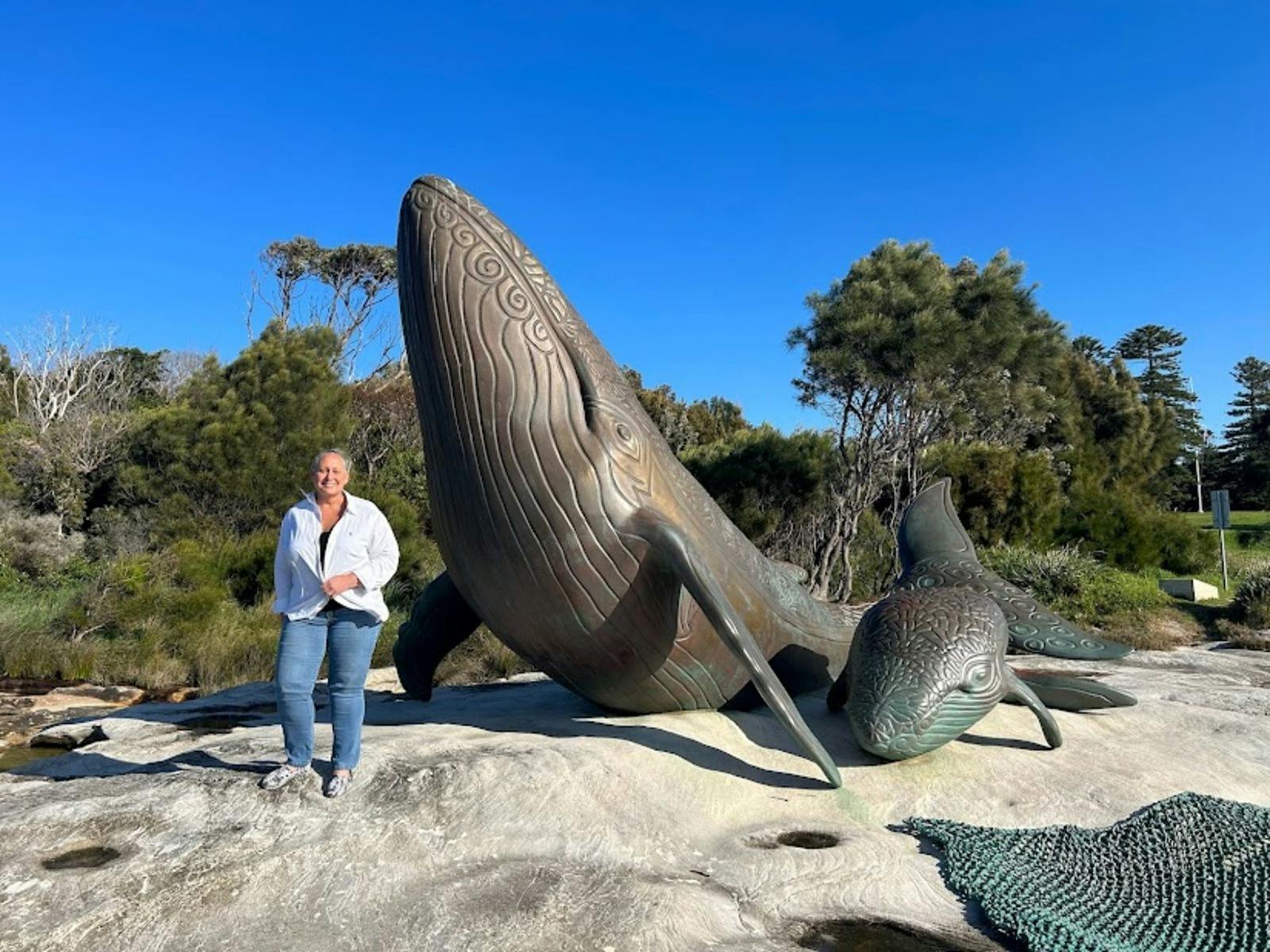 lady in front of whale sculpture at kurnell