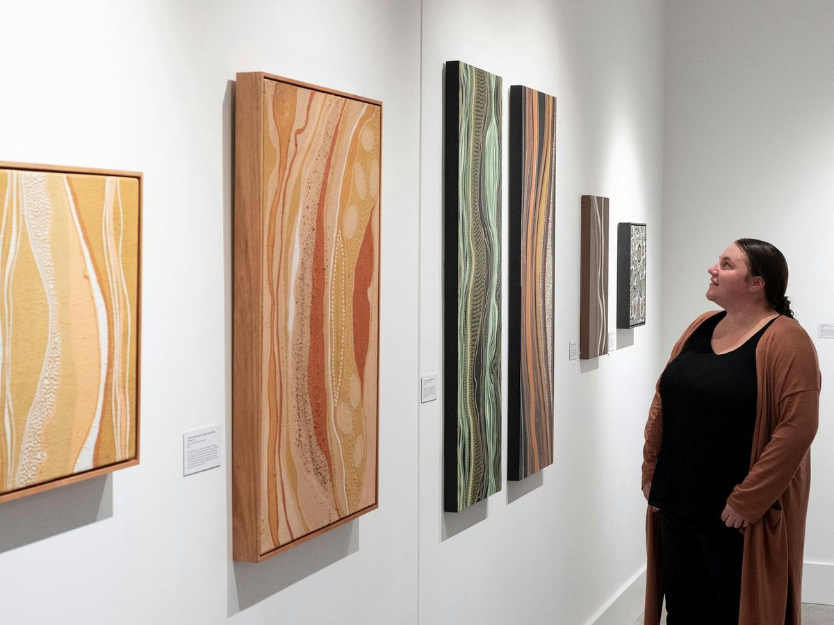 Arakwal artist Nickolla Clarke in her exhibition 'Gabul Jagun – Carpet Snake Country', 2022
