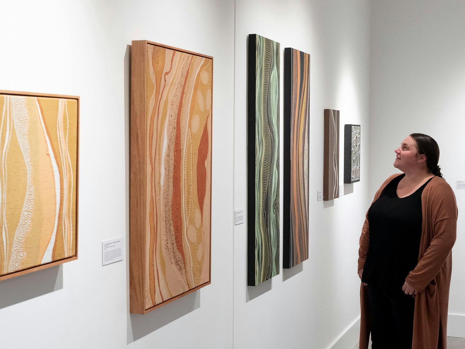 Arakwal artist Nickolla Clarke in her exhibition 'Gabul Jagun – Carpet Snake Country', 2022