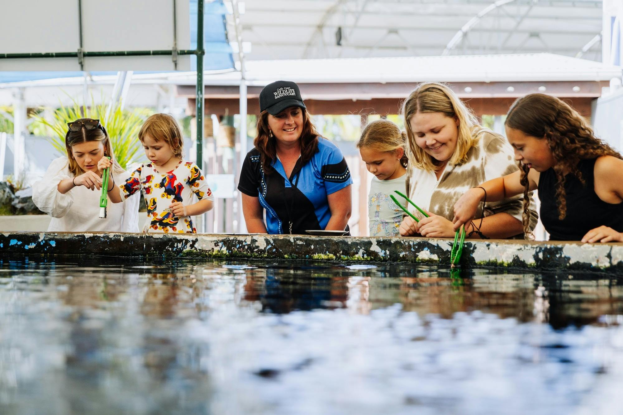 Daily animal presentations, including fish feeding and education programs.