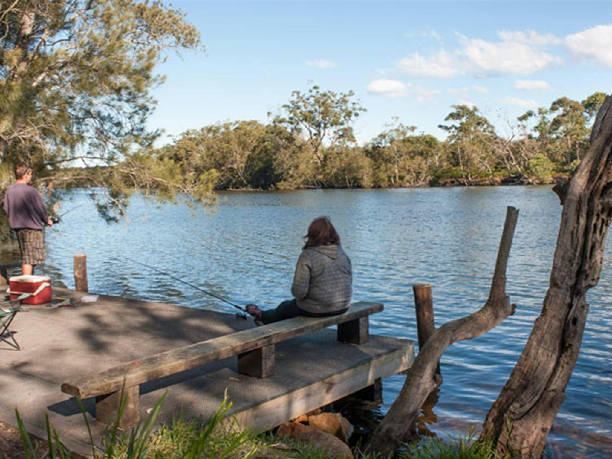 A person fishing at Wandandian Creek in Corramy Regional Park. Photo: Michael van Ewijk &copy; DPIE