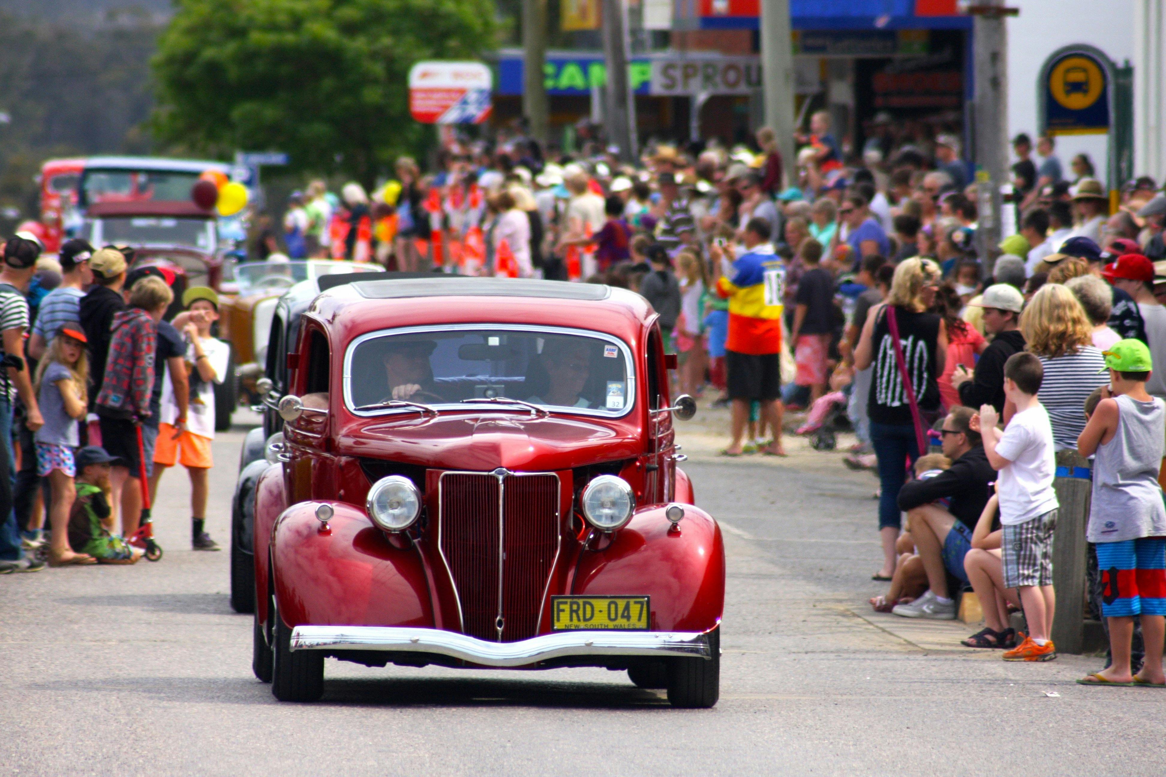Old cars get into the mix at the Eden Whale Festival street parade