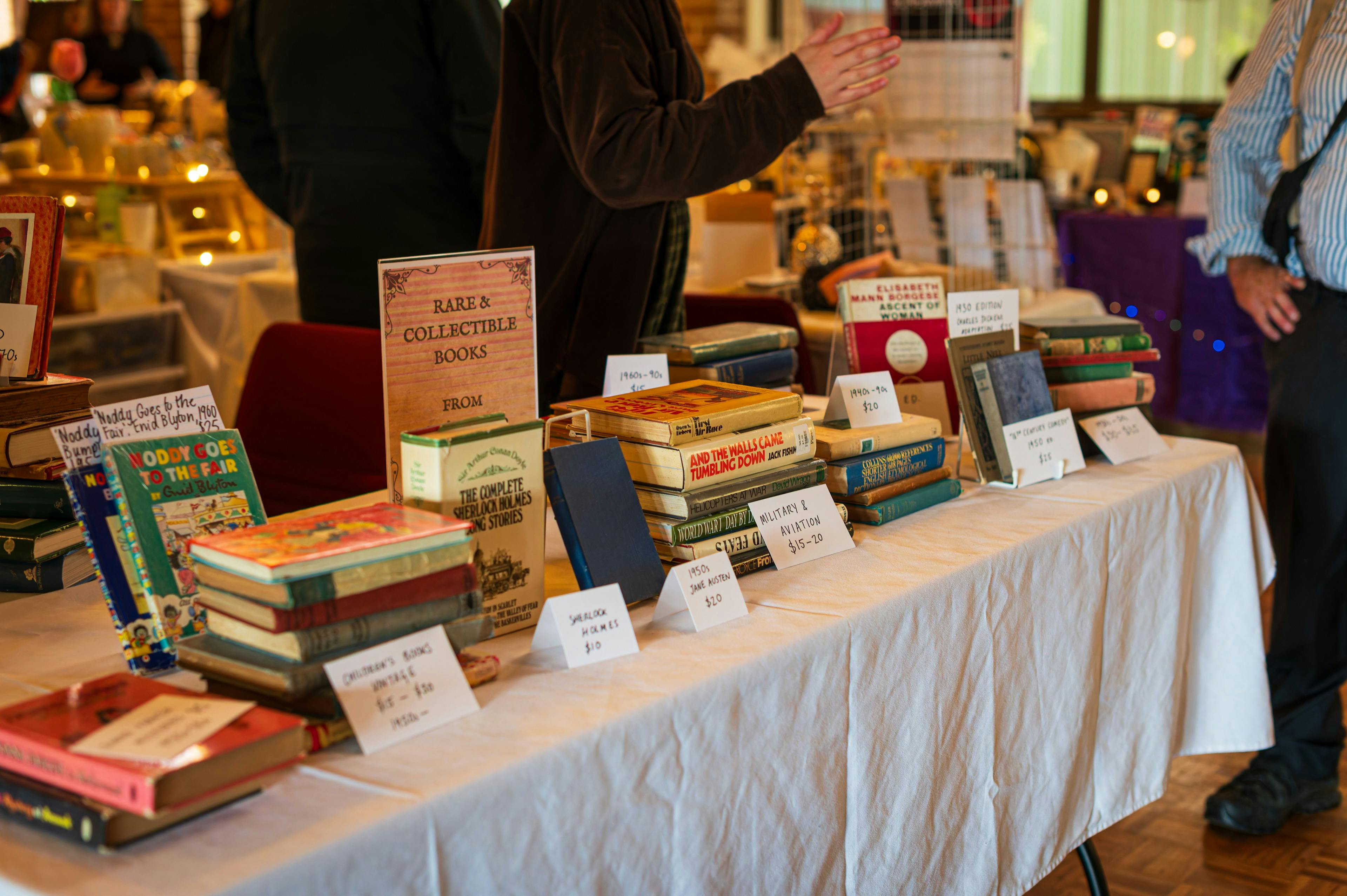 A market table full of vintage and rare books.