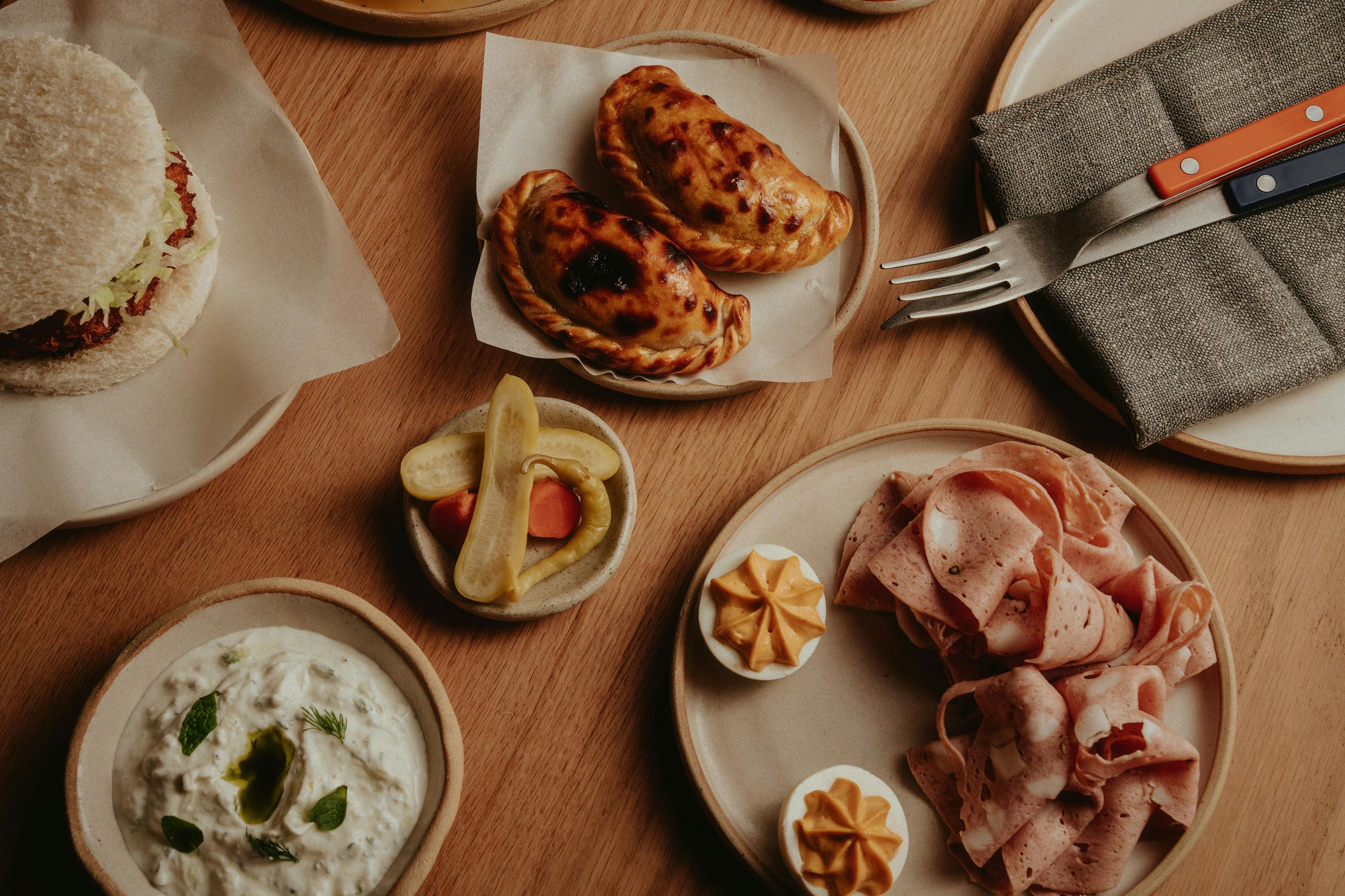 Bessie's Lamb Shoulder Empanada, Sala Mojo Picon Alma's Mortadella, Deviled Eggs & Pickles