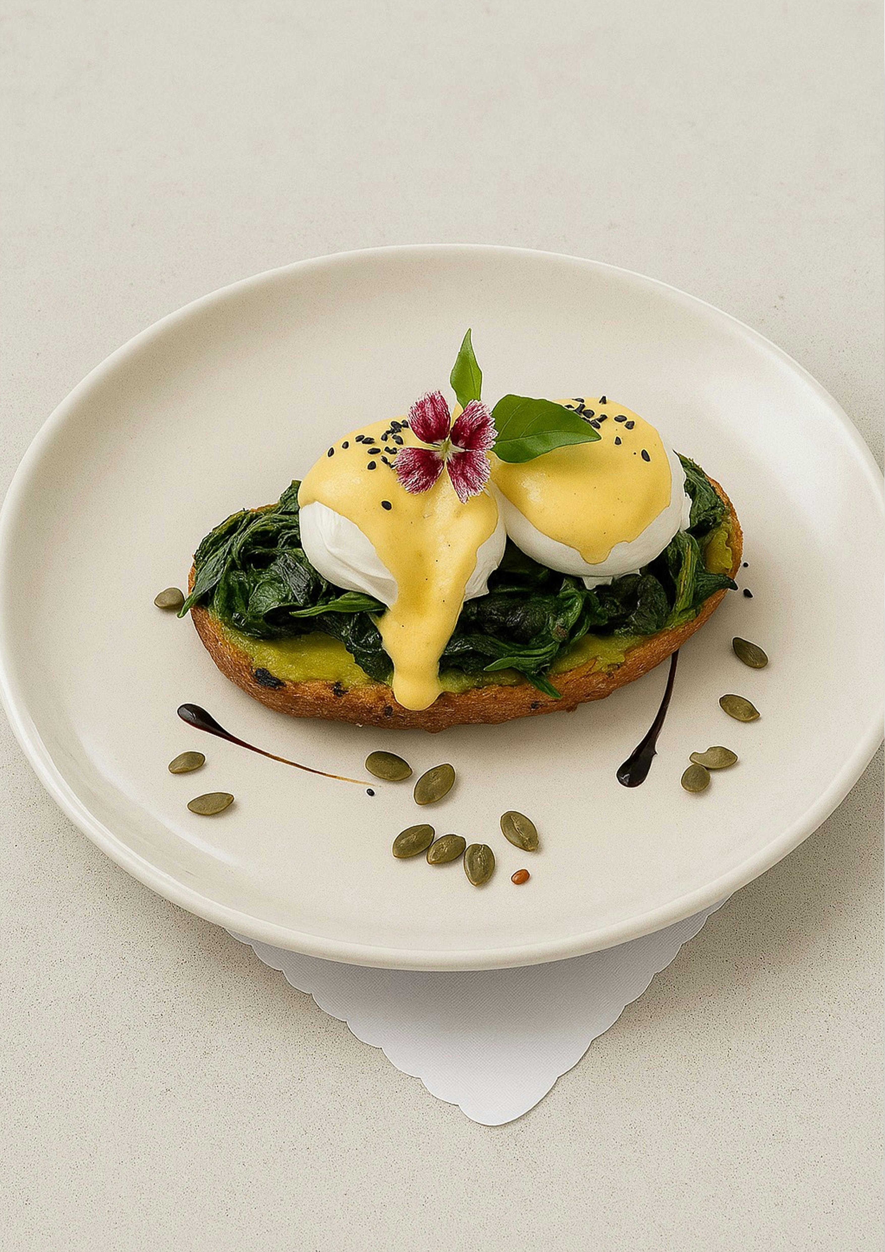 Esteria Eggs Florentine with spinach, poached eggs, and hollandaise.