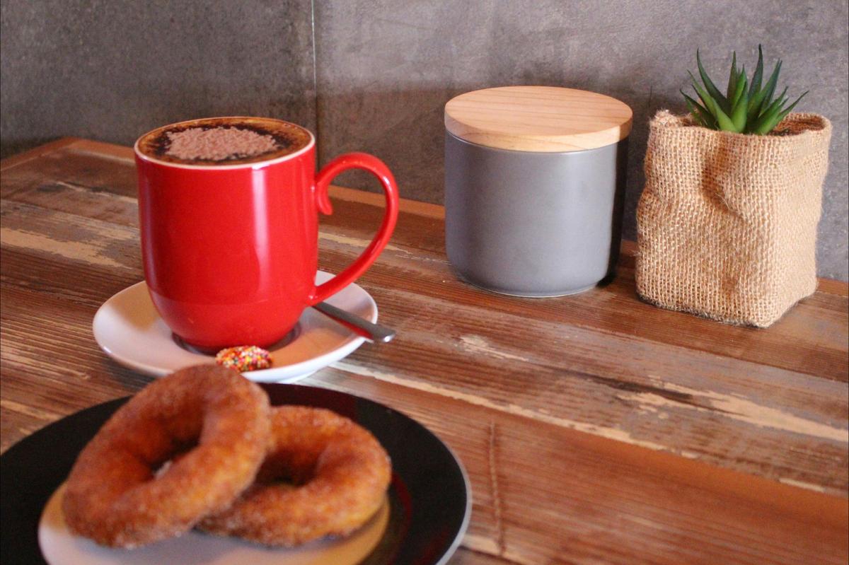Hot fresh donuts with a cappuccino  - the perfect mix!