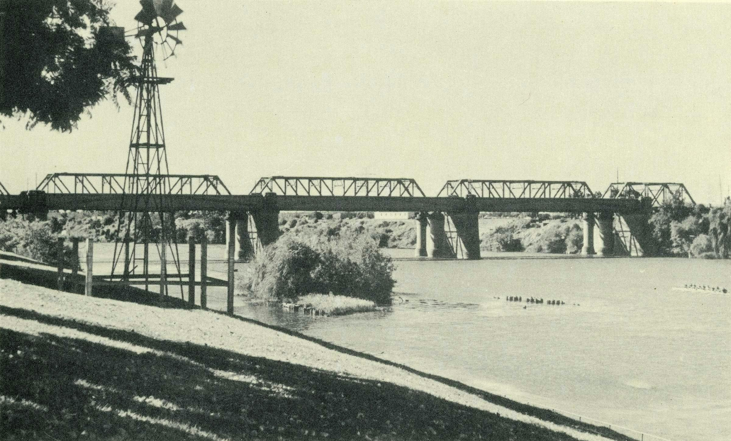 Victoria Bridge in penrith with rowers on river and windmill