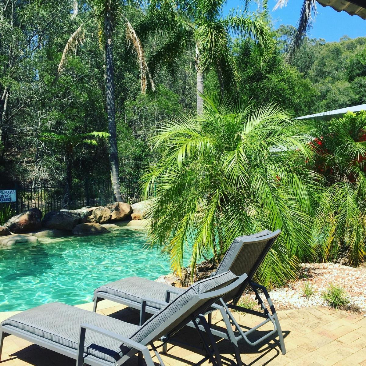 Salt water swimming pool and tennis court