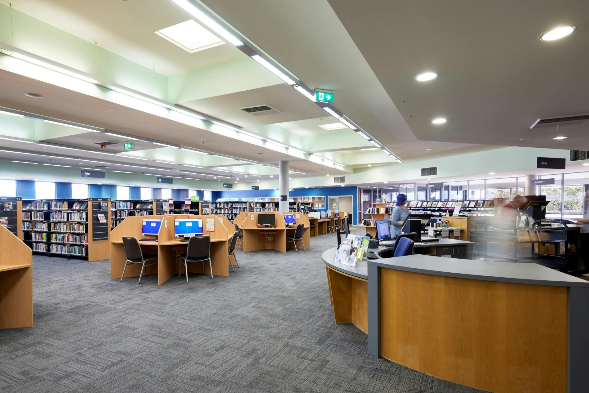 The spacious Library interior and service desk.