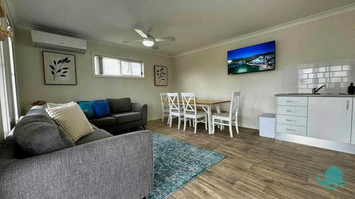 Cosy lounge room with wall mounted TV