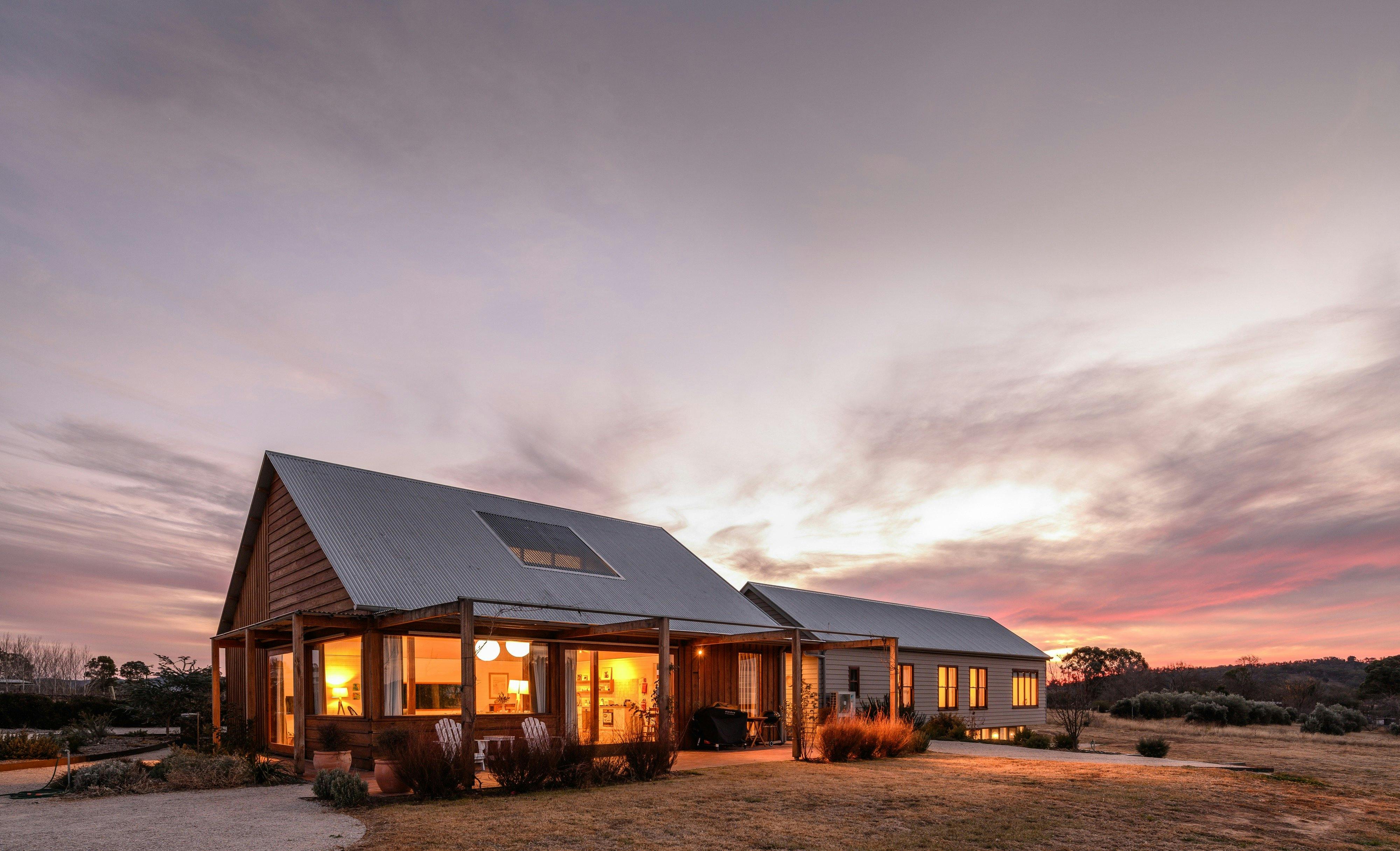 Abercorn house in the evening with lights on inside