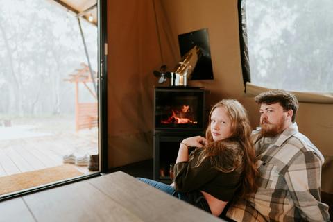 Couple enjoying inside fire