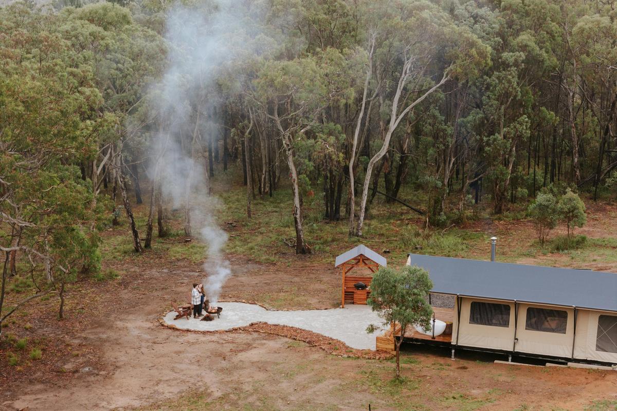 Aerial photo of tent, BBQ hut and firepit
