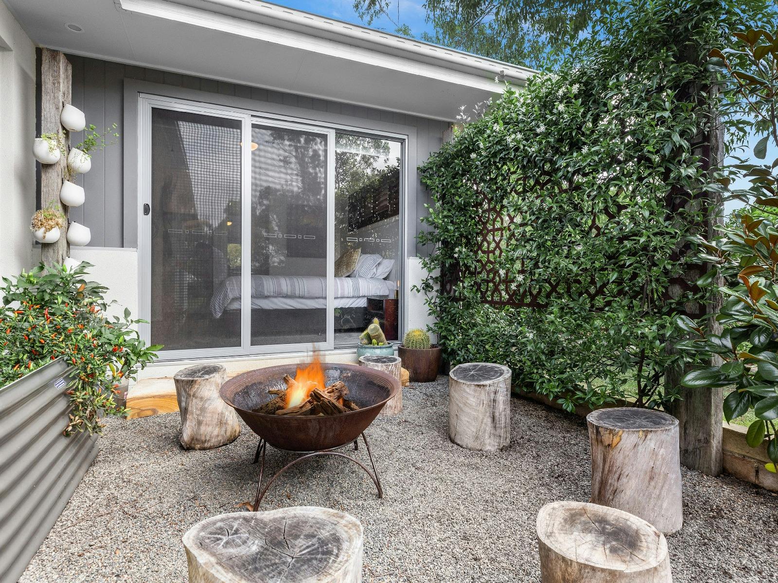 Alkira at The Vintage outdoor firepit and entertainment area