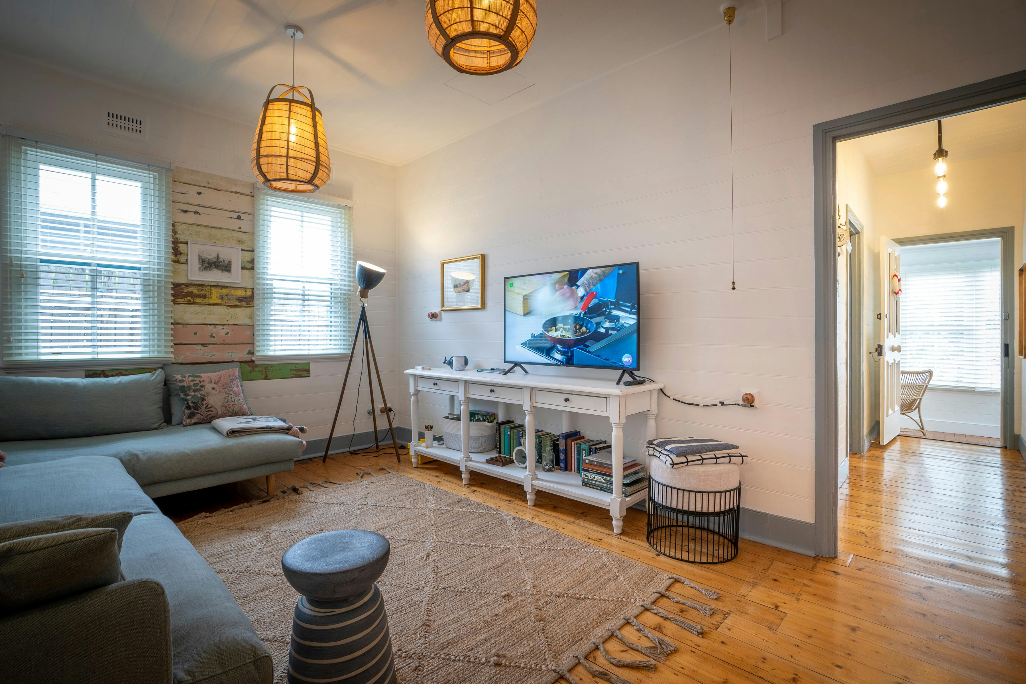 Cozy up on the  generous sofa and watch your favourite show