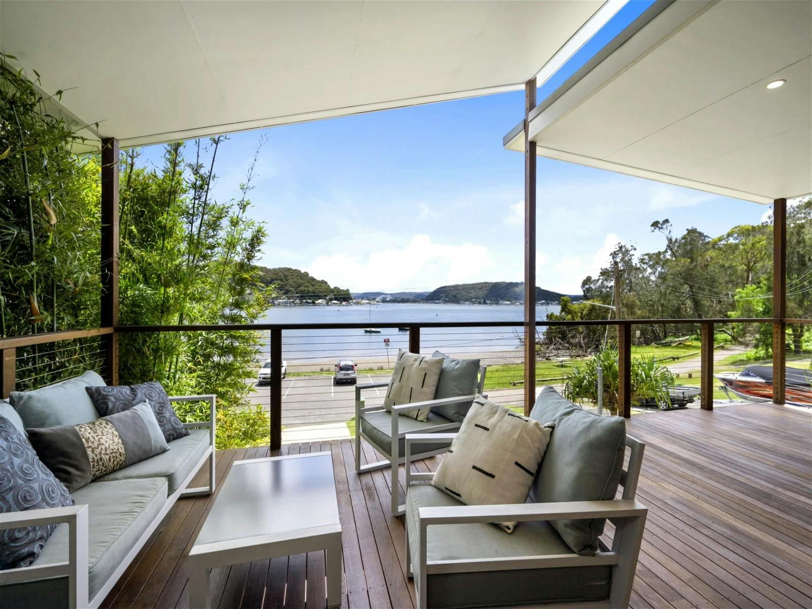 Balcony lounge overlooking tranquil waters
