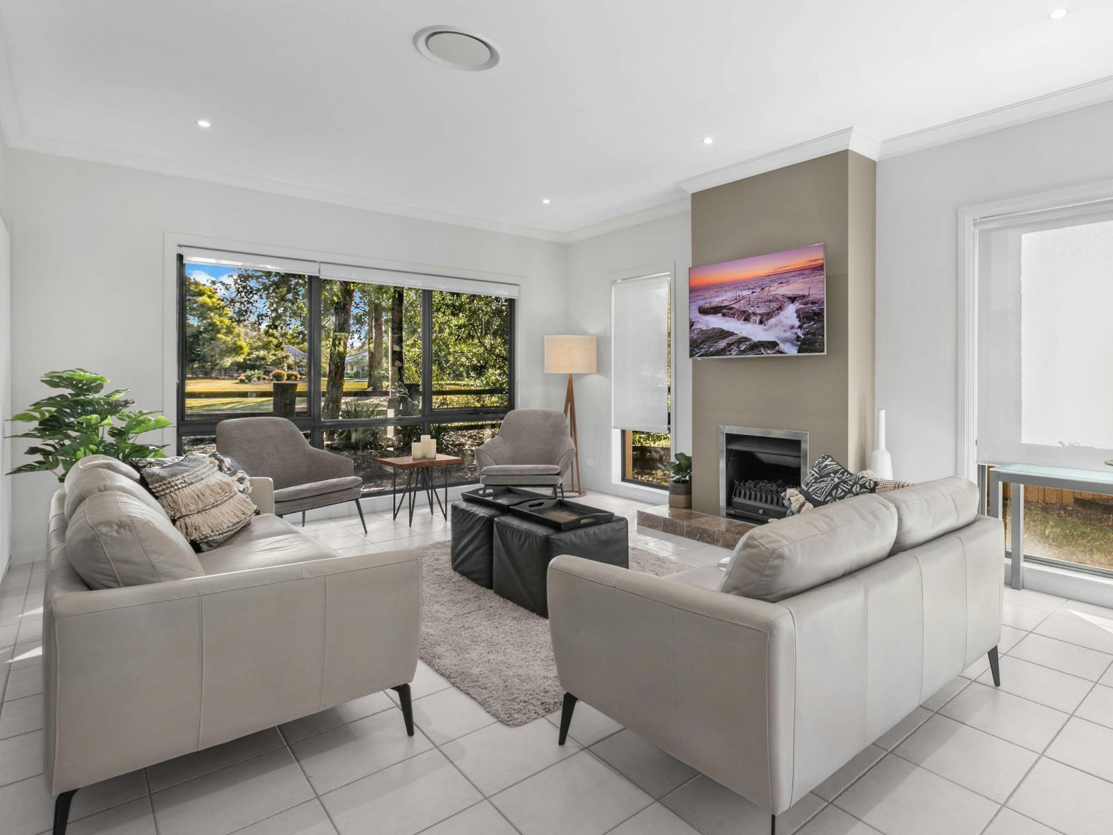 Amaroo Lodge lounge room with fireplace and TV