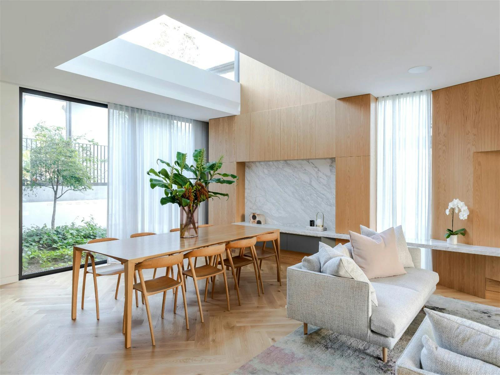 high ceilings, tons of natural light, parquetry flooring, and contemporary design