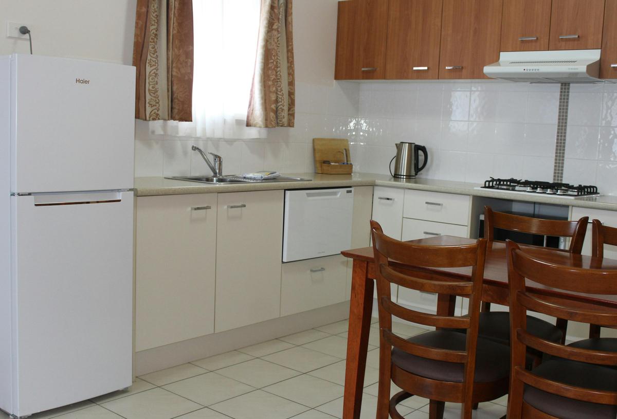 Kitchens with dishwasher and full sized fridge