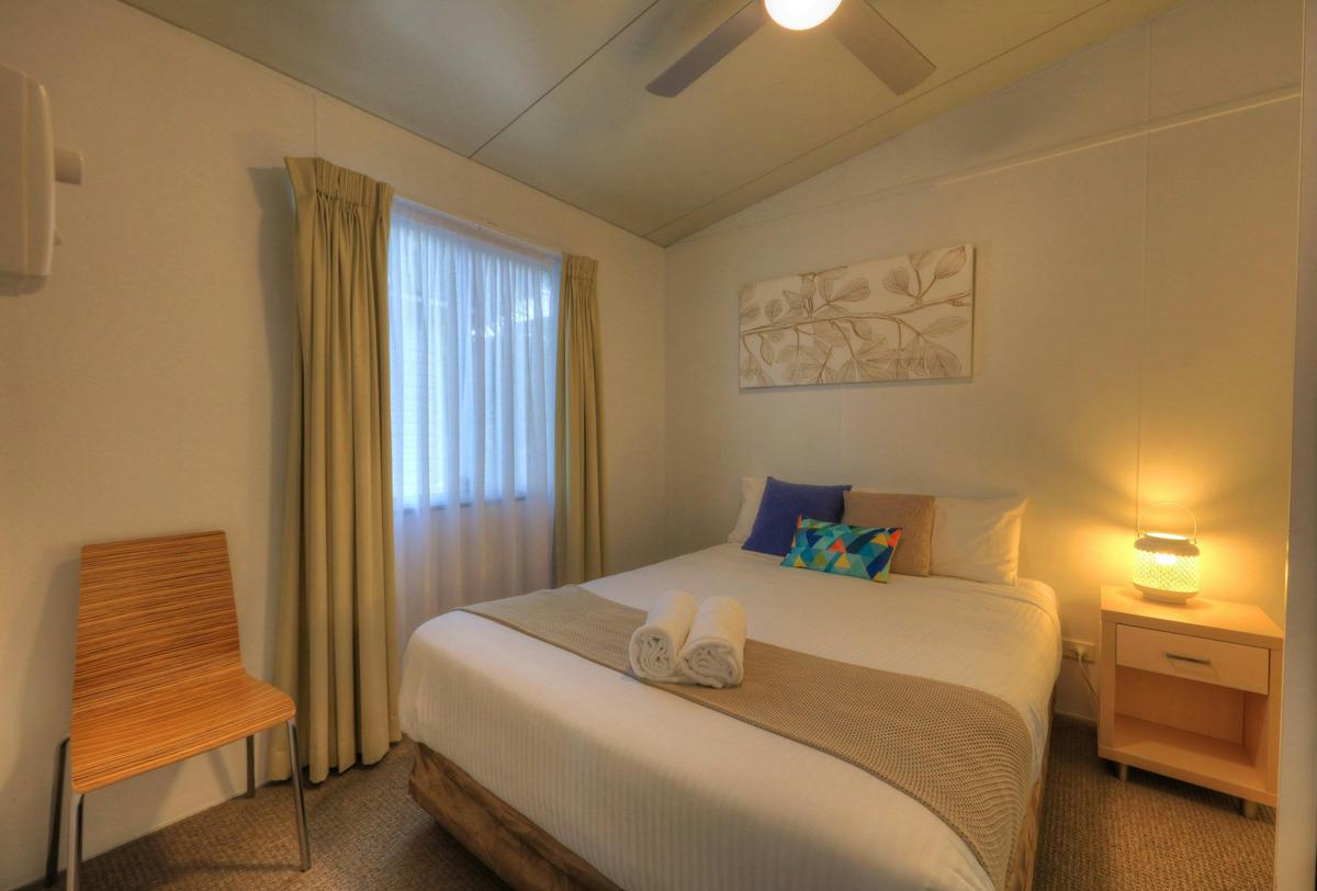 Waterview Lodge main bedroom at BIG4 Koala Shores Holiday Park