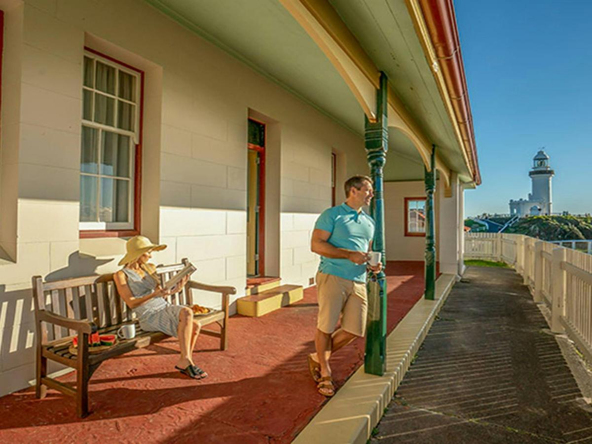 A couple relax on the verandah of the Assistant Lighthouse Keepers Cottage. John Spencer/DPIE