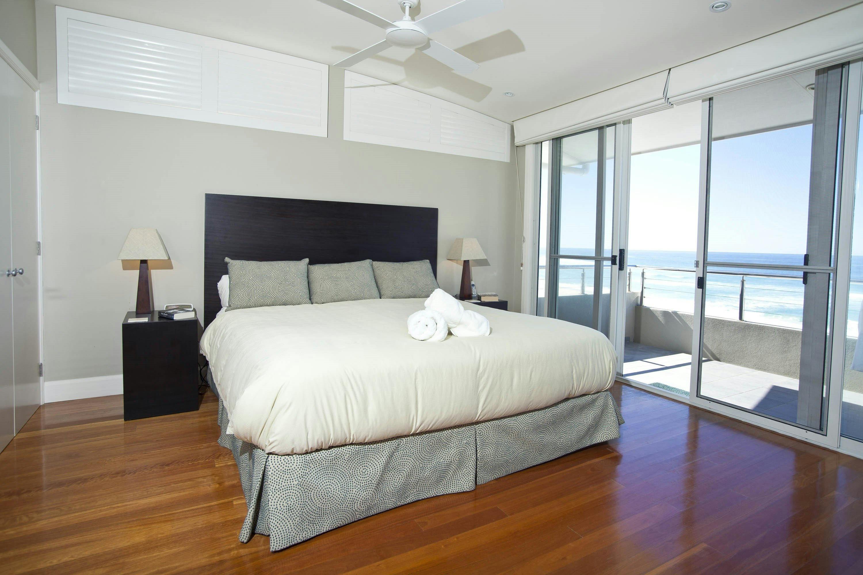 Azure's large master bedroom and private balcony overlooking the beach