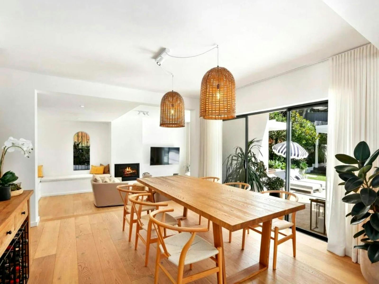 Dining area flowing into another sitting area, connected to the stylish open kitchen