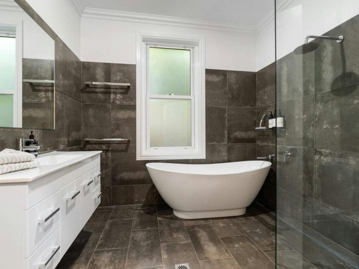 Bathroom with bath at Barton House