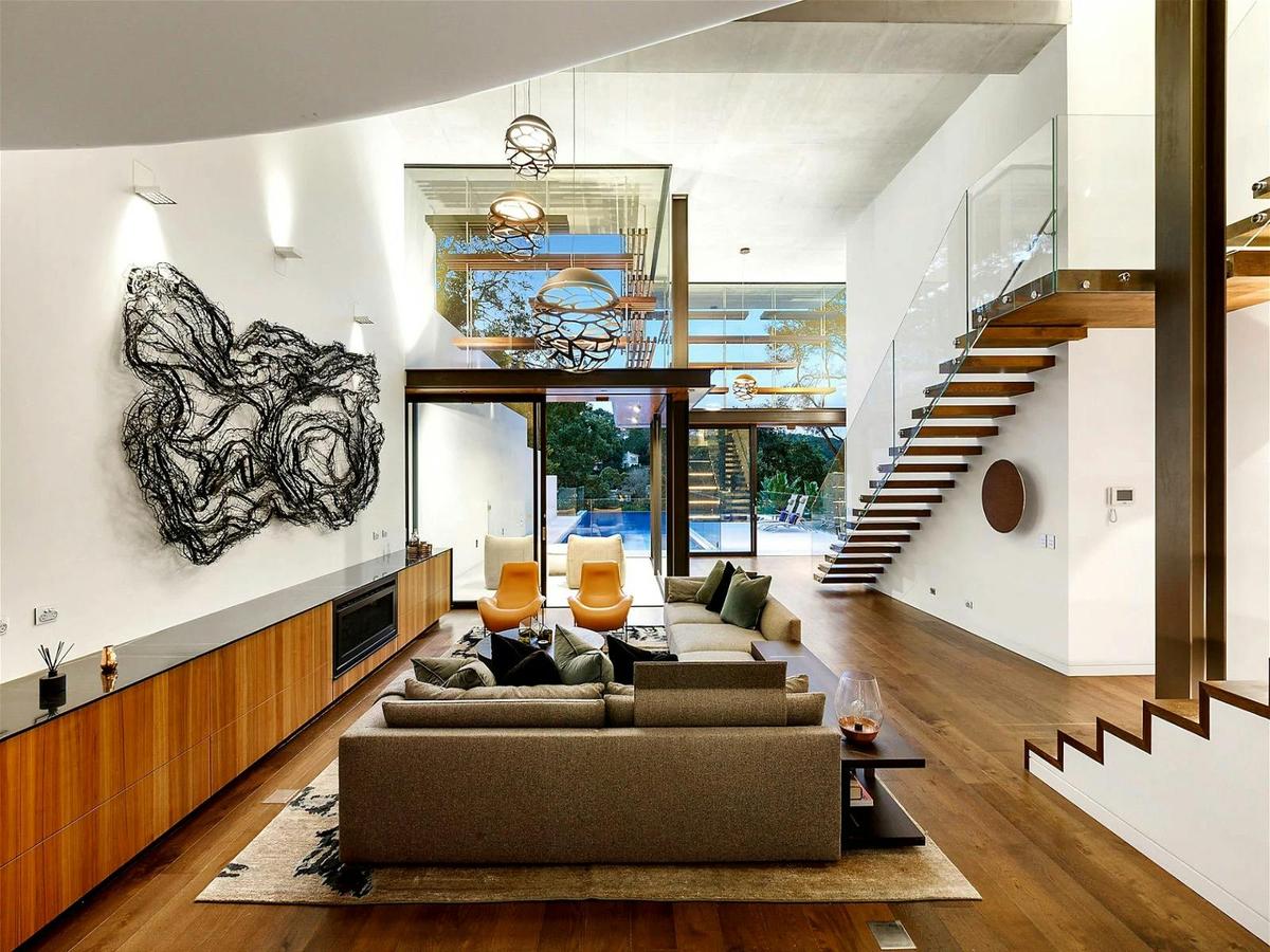 the lounge room with its dramatically 7 meter high ceilings