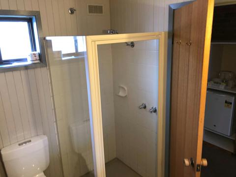 Ensuite Shower with clear screen opening door and tiles