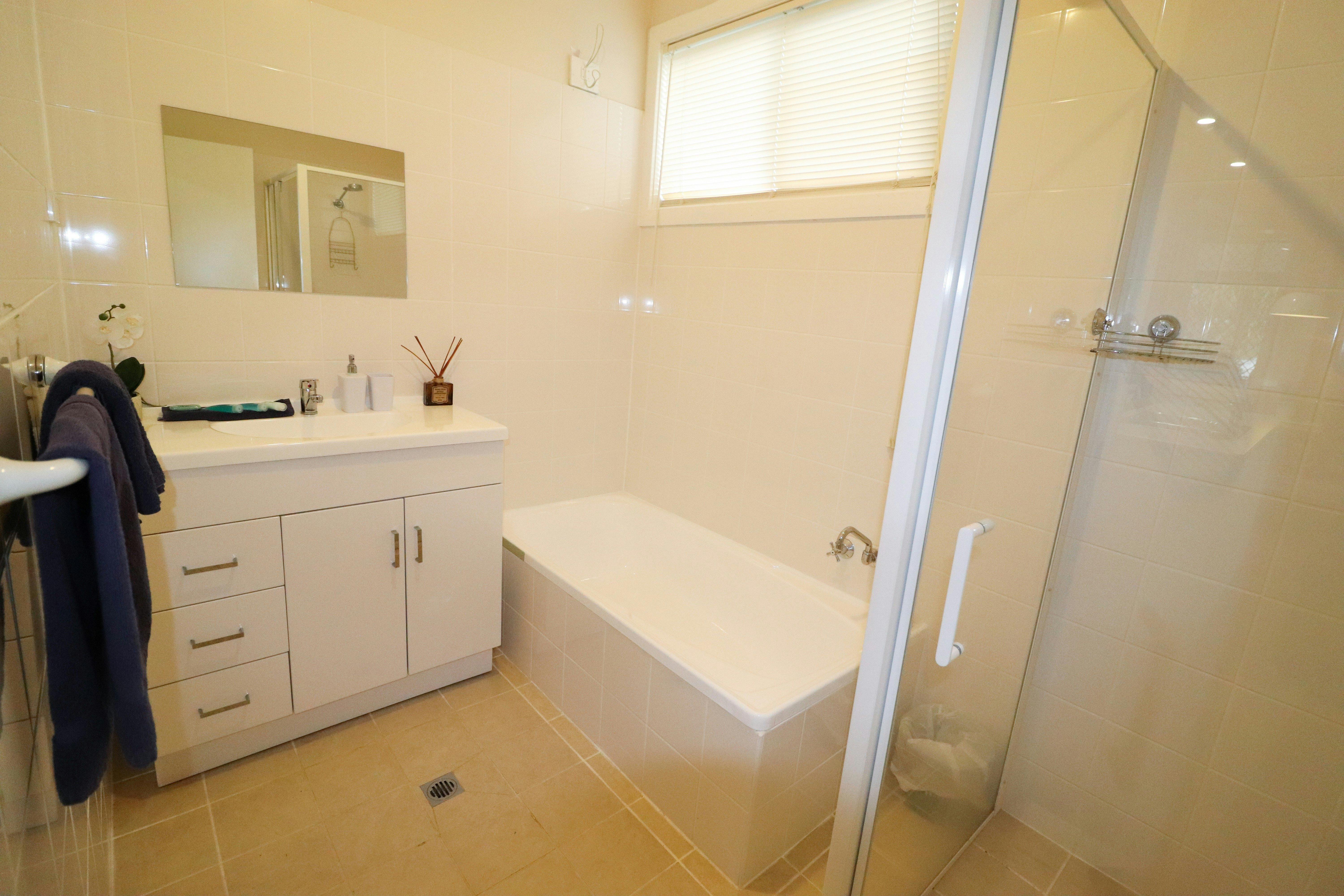 Bathroom with shower and bath