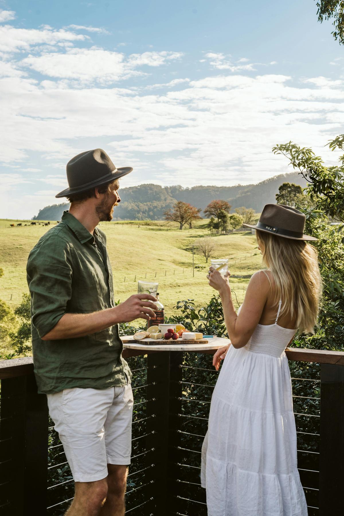 Raised balcony adorned with comfortable outdoor lounges, the breathtaking view of the  7-acre proper