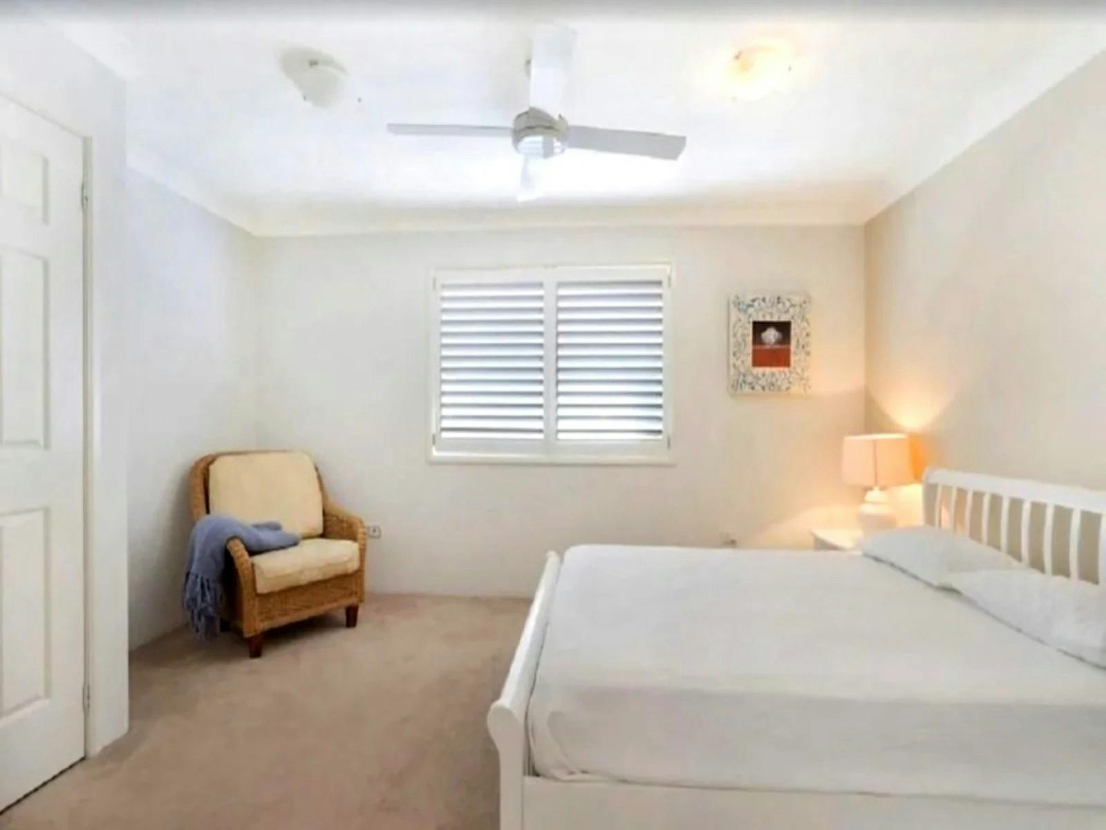 large master suite, with a queen bed, a comfortable sitting area, an ensuite bathroom
