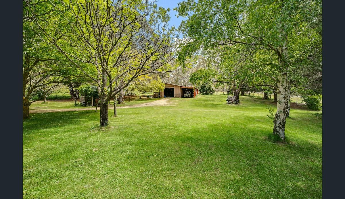 Rolling green lawns, gardens and fruit trees surround the house at Big Yard Farm