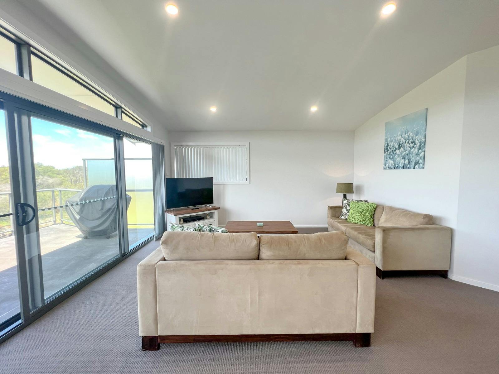 Spacious living area with TV