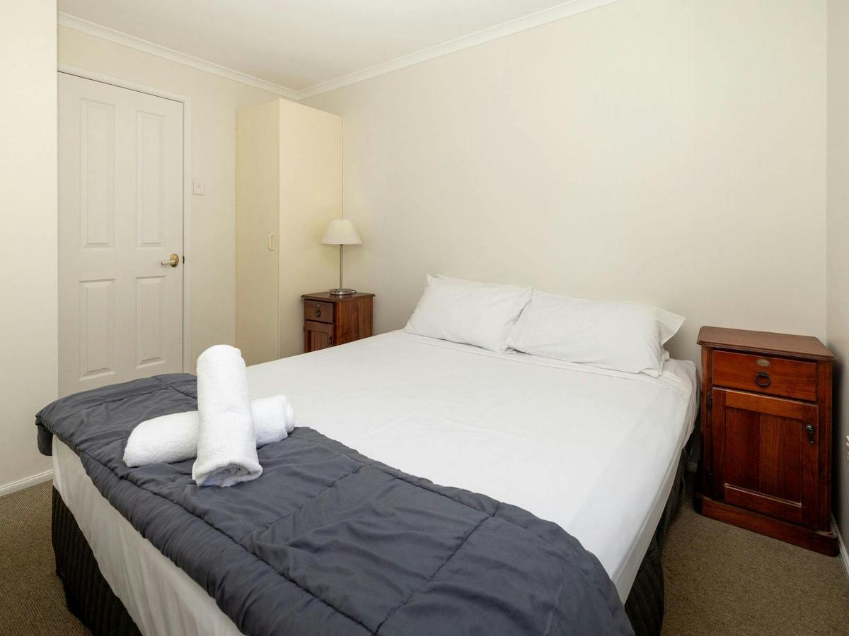 2nd bedroom with double bed and bedside tables