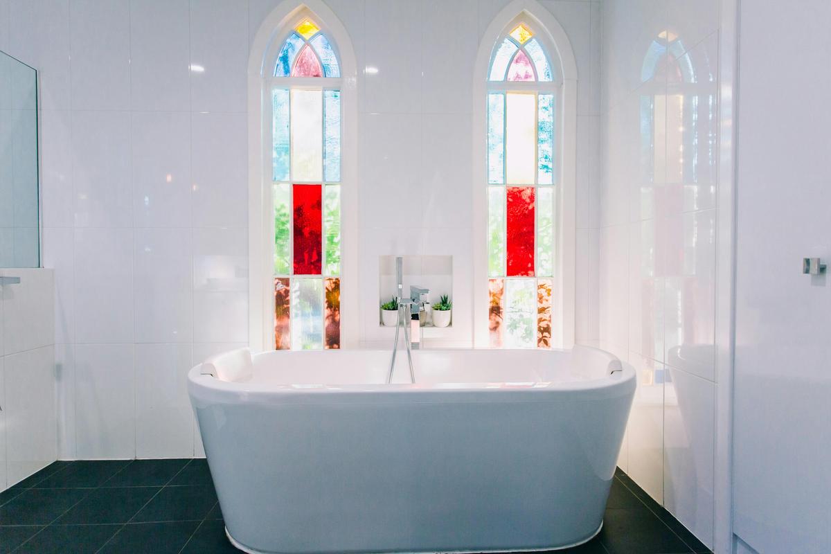 Original 1882 stained glass windows in the family bathroom