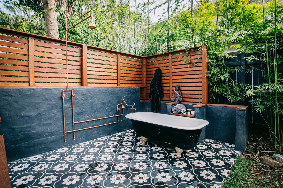Outdoor Bath and shower with beautiful ambient lighting for a nighttime soak at the Converted Church