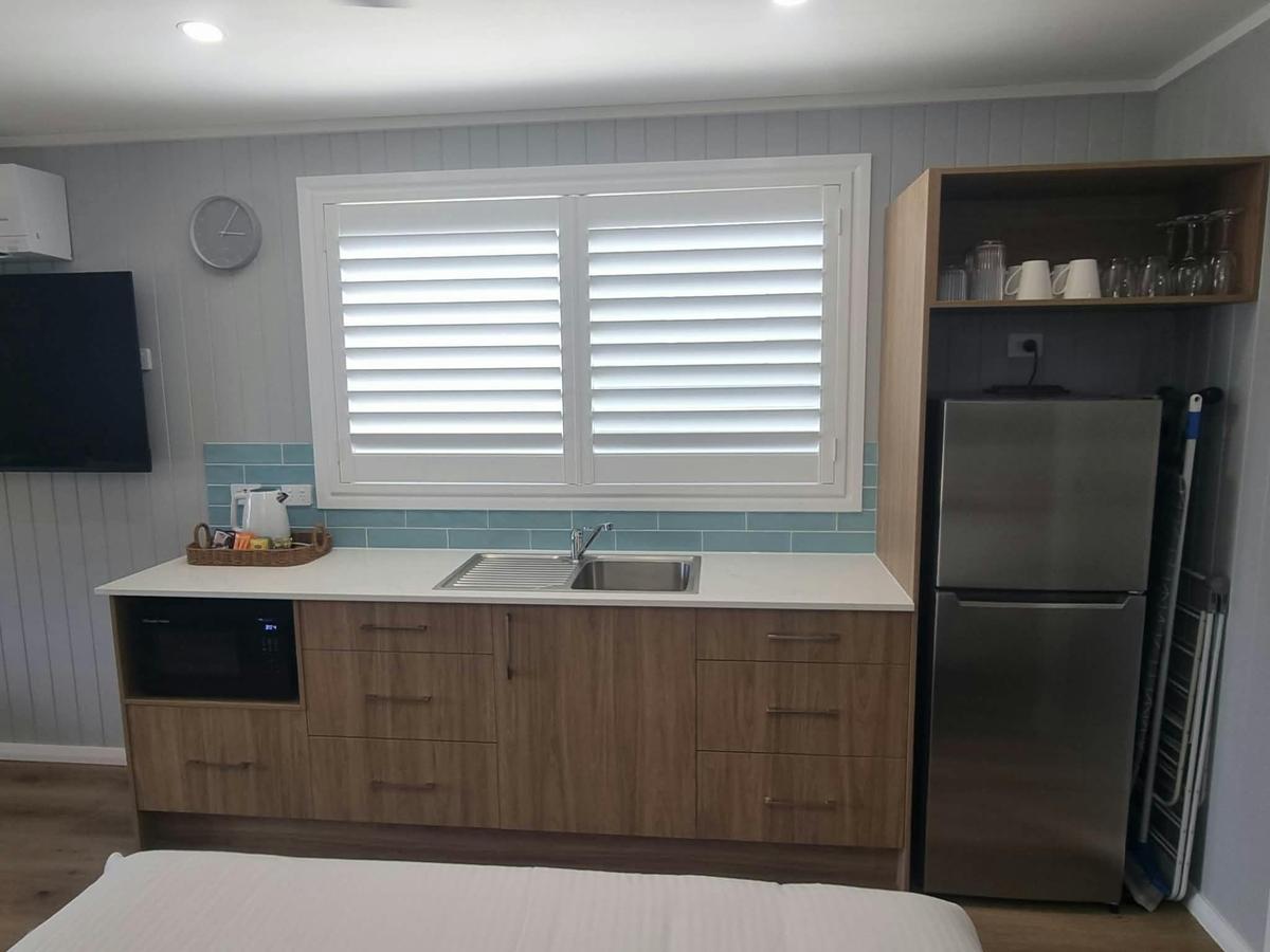 Kitchenette features tea making facilities,large refrigerator and sink