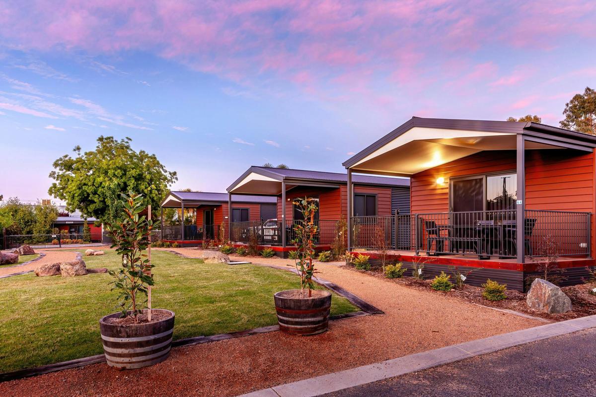 The exterior of the cabins, with the gardens in view