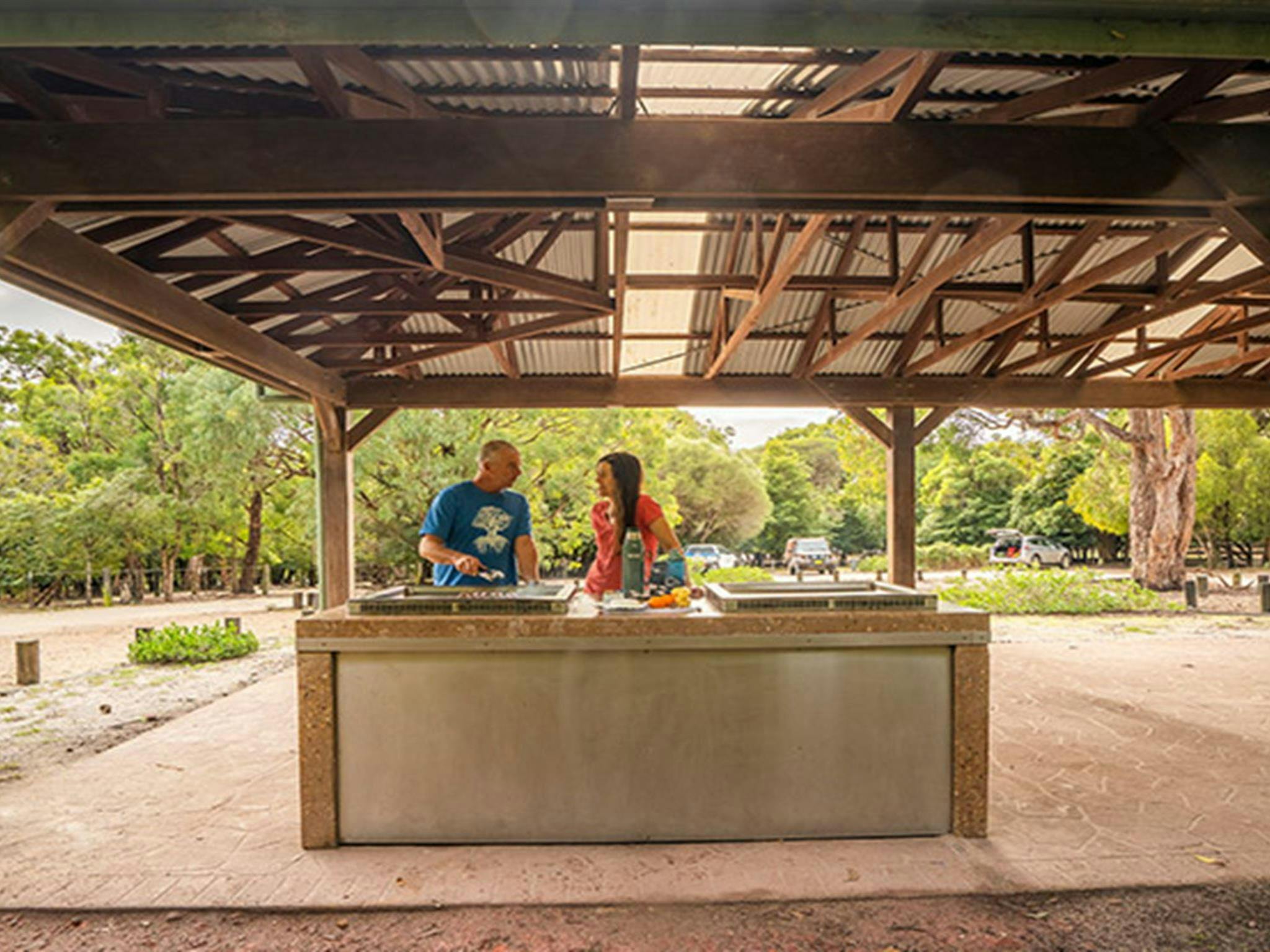 People using barbecue at a shelter at Bittangabee campground, Beowa National Park. Photo: John