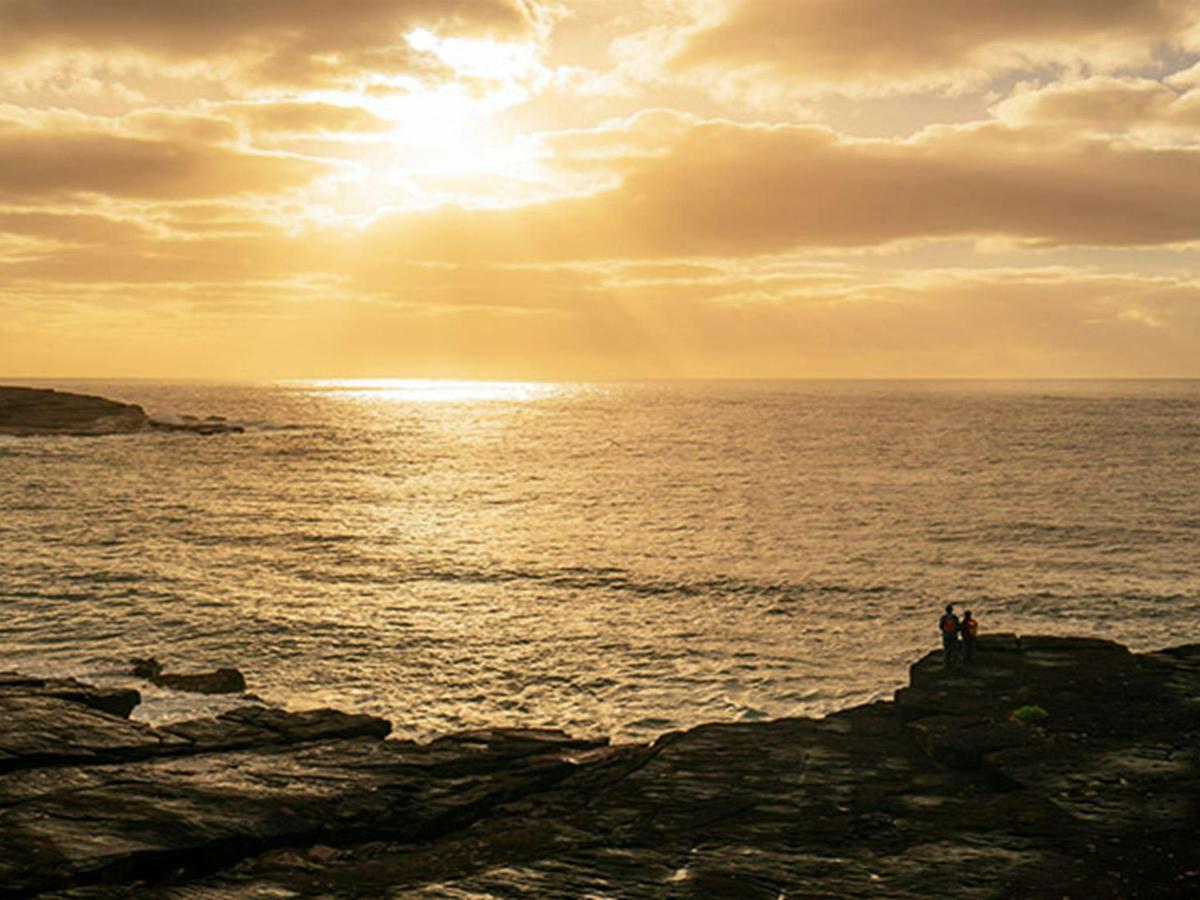 Walkers on the coastal cliffs near Bittangabee campground, Beowa National Park. Photo: John