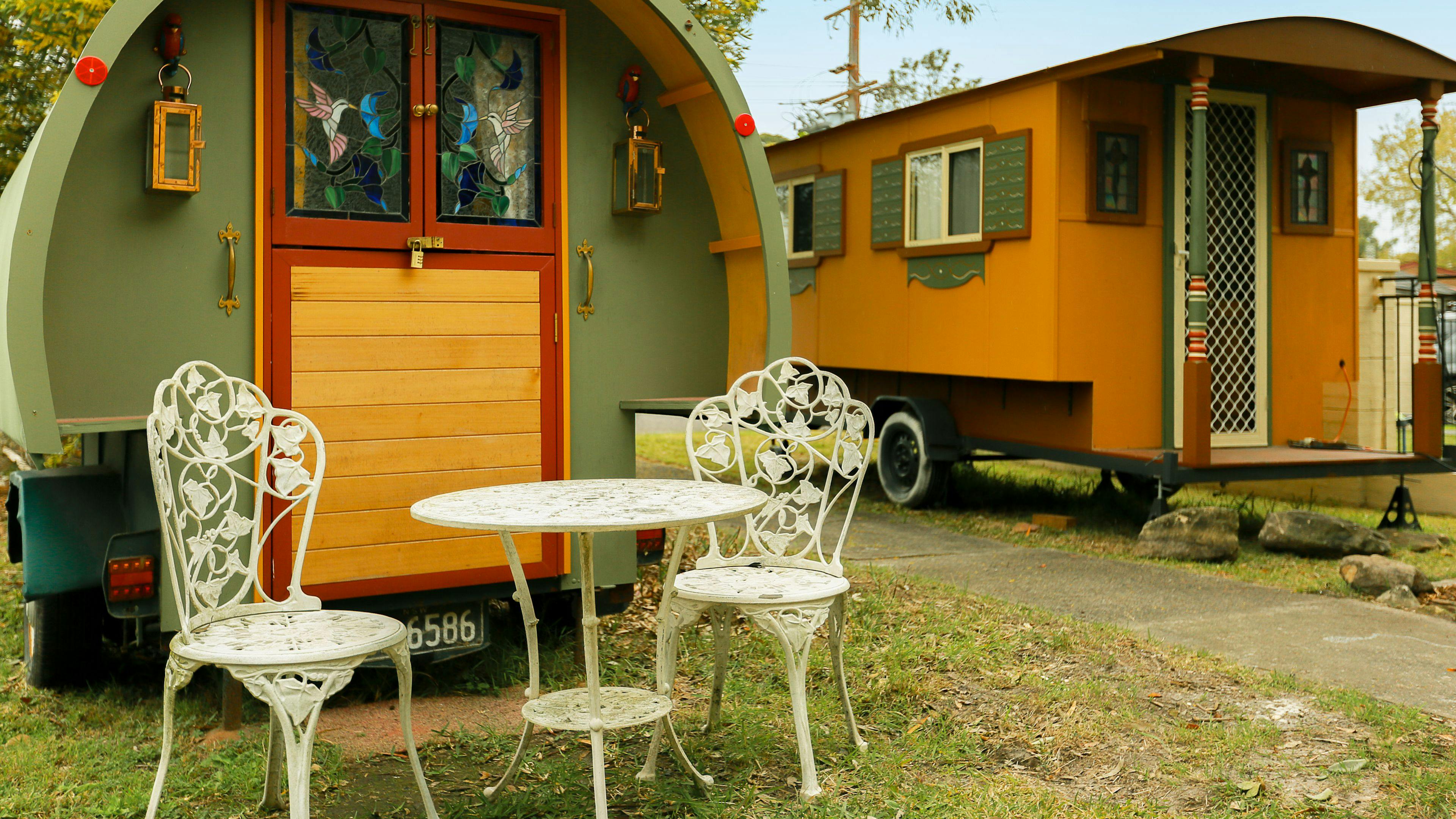 2 gypsy caravans at the front of the house - little green sleeps 2, bigger brown sleeps 4