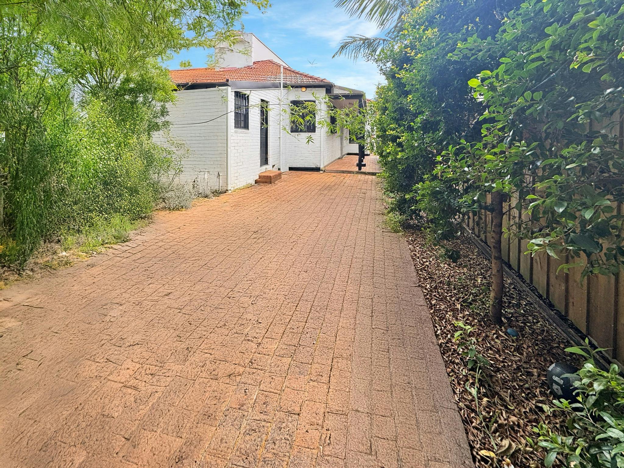 Explore this charming outdoor space, perfect for enjoying the greenery and fresh air.