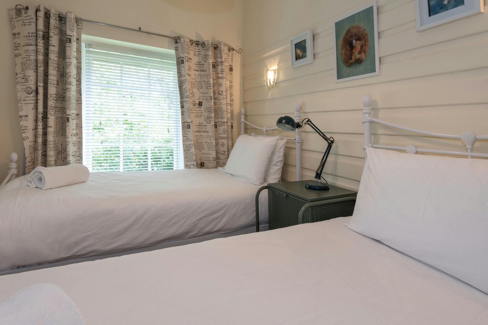 Bedroom 2 has two single beds.