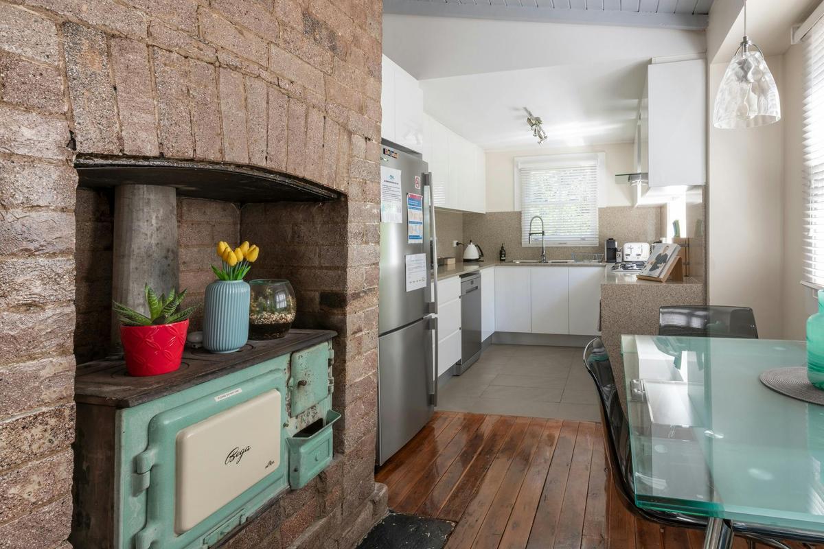 Fully equipped kitchen with modern appliances and pantry essentials provided.