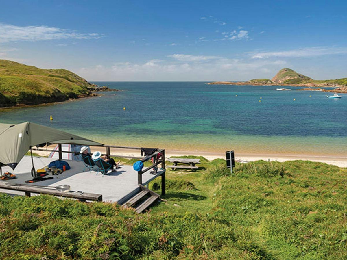 View of the ocean and camping platform at Broughton Island campground, Myall Lakes National Park.