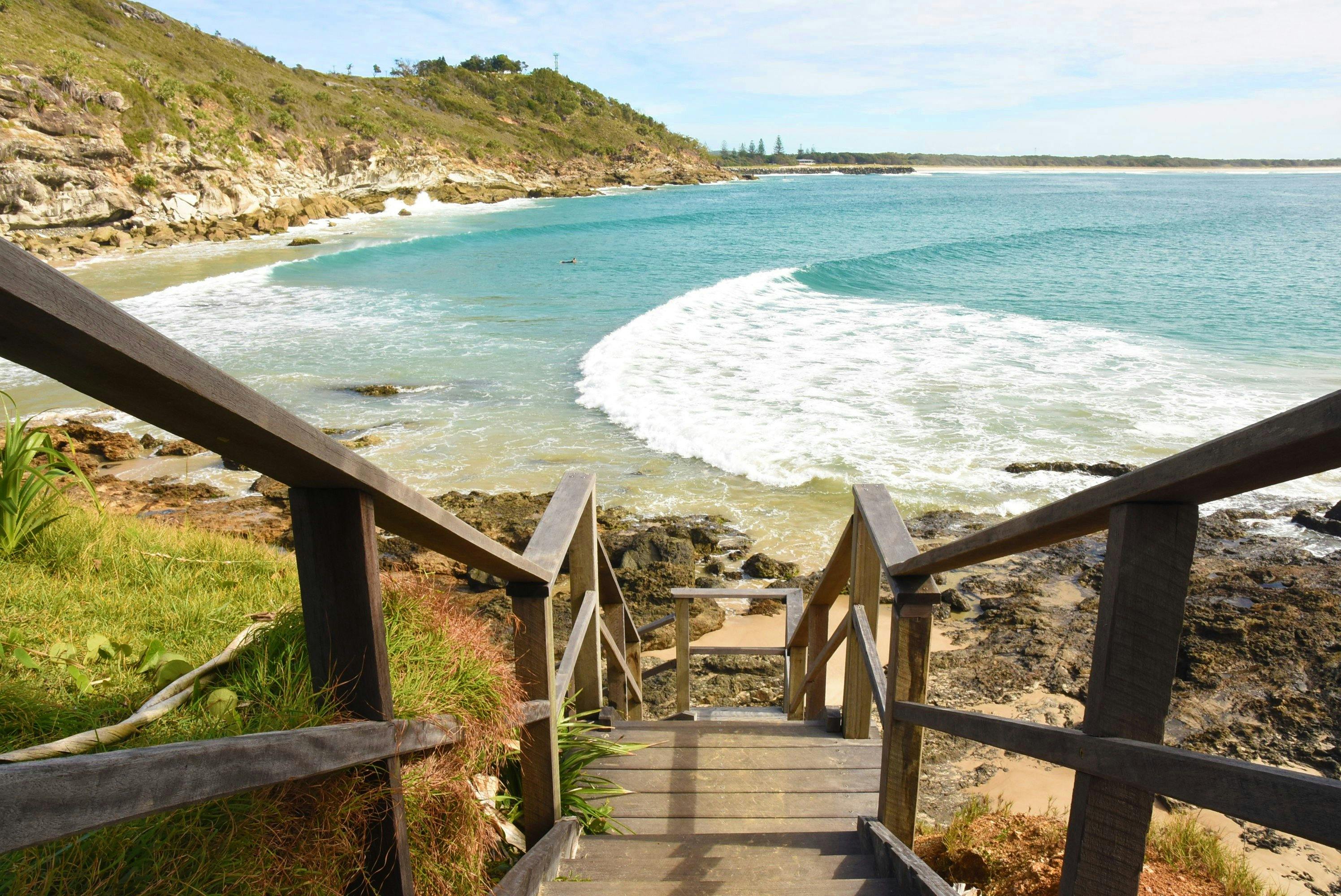 Half Tide Beach stairs in Evans Head leading into the water.